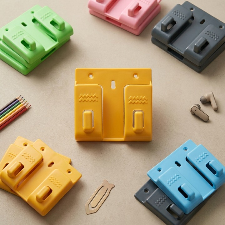 Pack of 10 Wall Mounted Universal Mobile Phone Holders – Space-Saving Charging Stand & Remote Organizer (Random Colors)